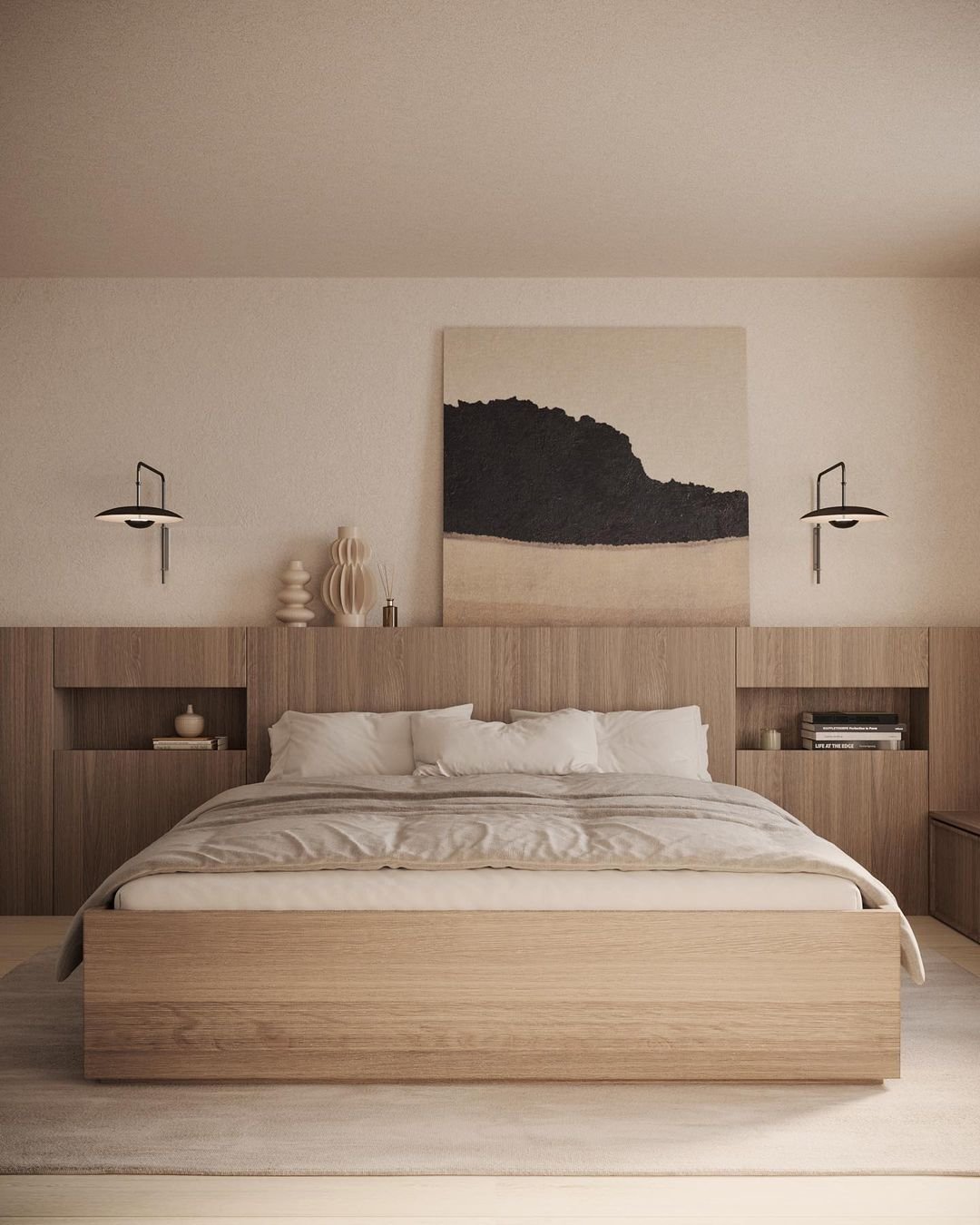 Minimalist bedroom with a wooden bed frame, neutral bedding, and a large abstract painting above the headboard. Two wall-mounted lamps flank the bed, and built-in shelves hold decorative items. Discover how to incorporate meaningful artifacts in your Japandi bedroom for a personal touch.