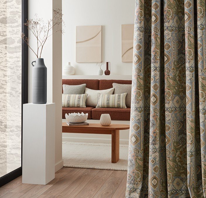 adding texture and visual interest to an interior space can easily be achieved by using textured fabric curtain like in this example