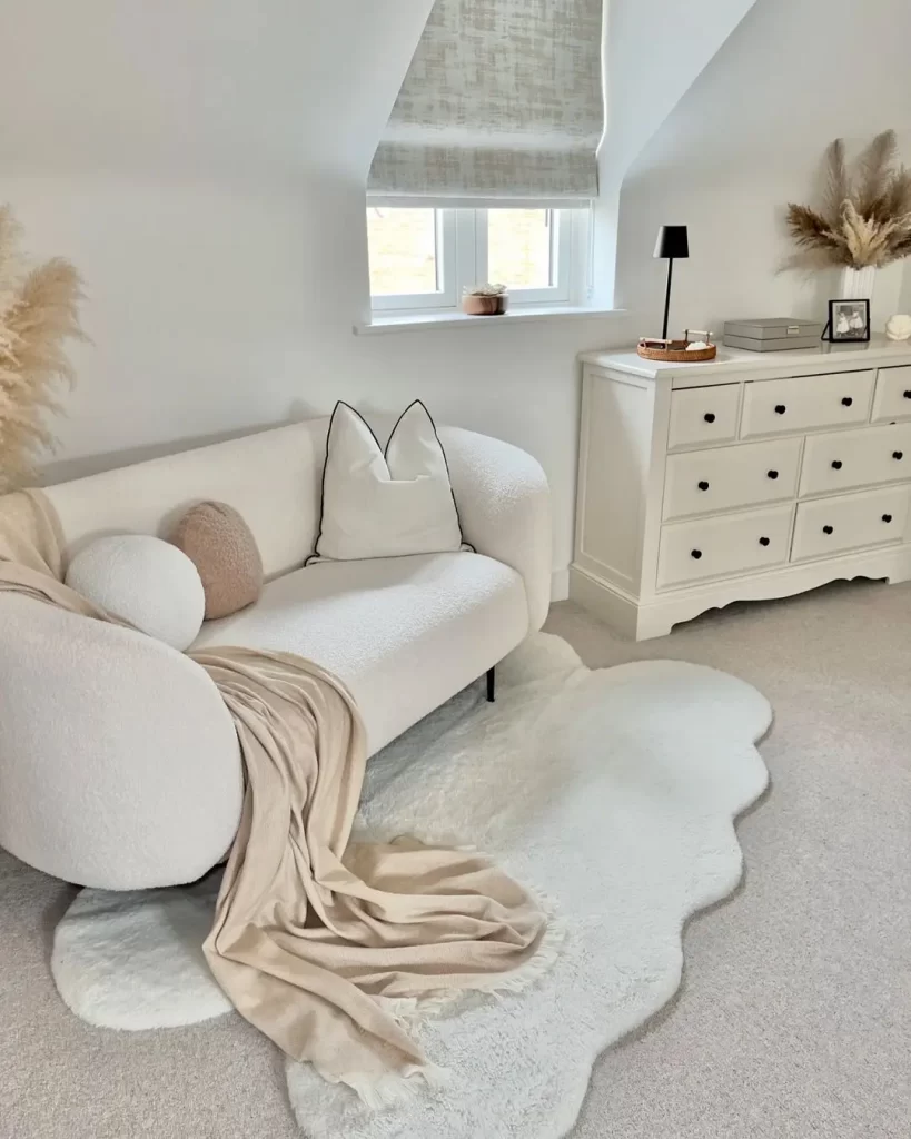 a plush floor rug next to a sofa is a great way to anchor and add comfort and style to this living room.
