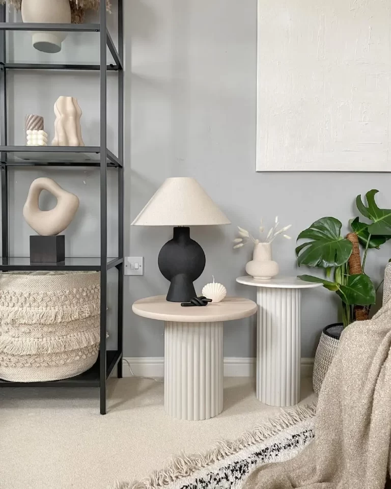 pairing two side tables next to each other can be used to style various items, add visual interest, and functionality to a living space.